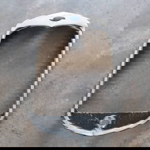 1930 Ford Model A Radiator Shell: Original, used stainless steel shell with Ford emblem - missing crank hole cover. In good condition with minor dents