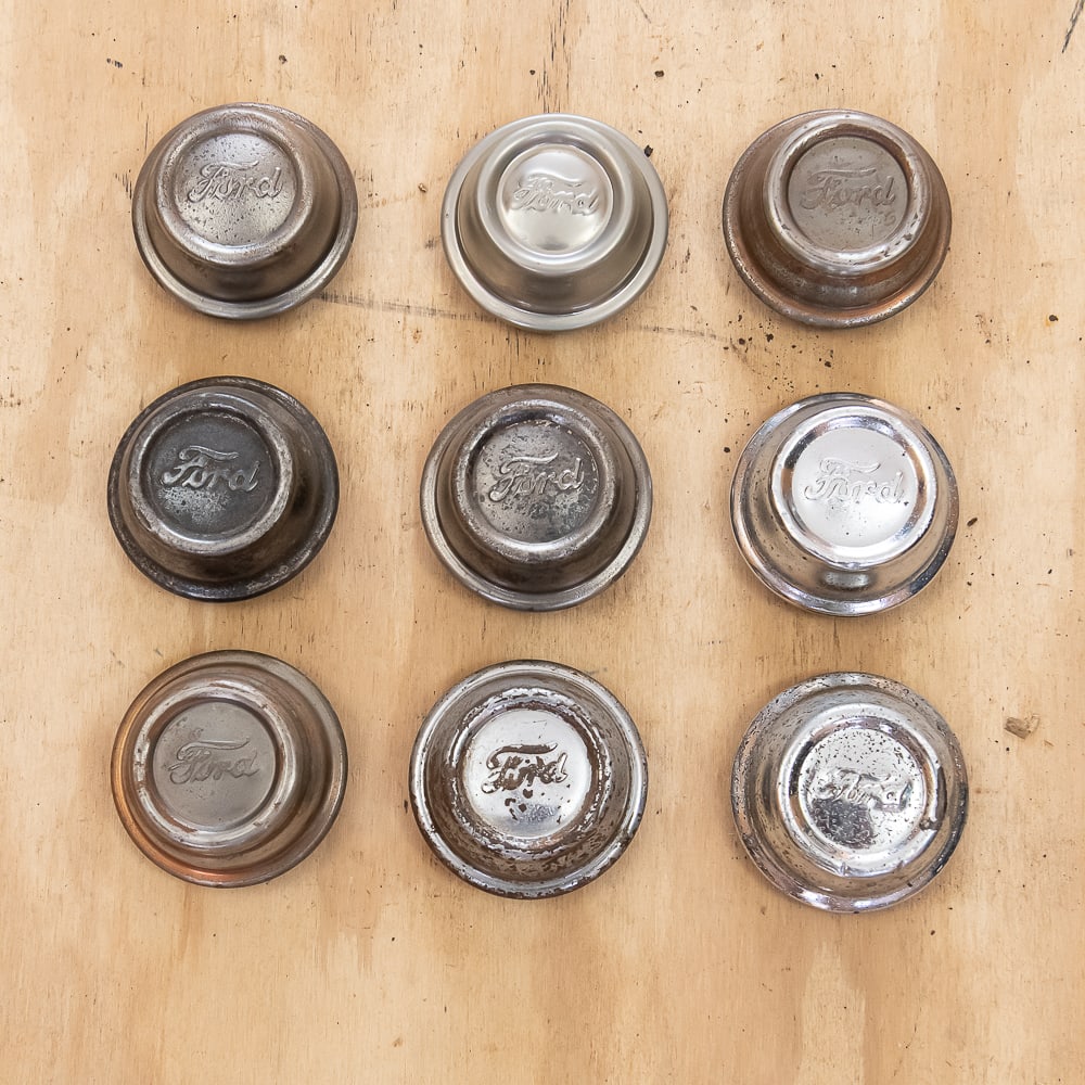1928-29 Ford Model A Hub Caps (10): Original caps in various condition. See pics