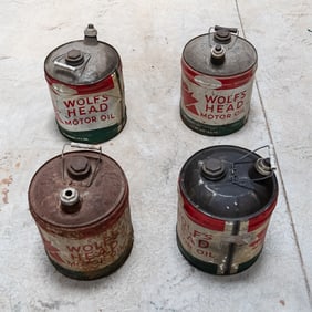 4 Vintage Wolf' Head Motor Oil Cans