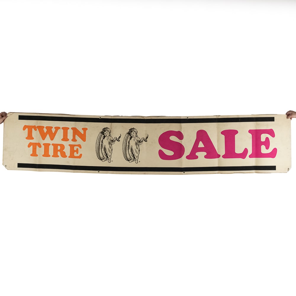 Fisk Twin Tire Sale Banner 1930's: Fisk “Twin Tire Sale” Banner. Circa 1930’s. In good condition, with a tear on top edge and from storage (along folds). With original string at corners. A major player in the tire ind