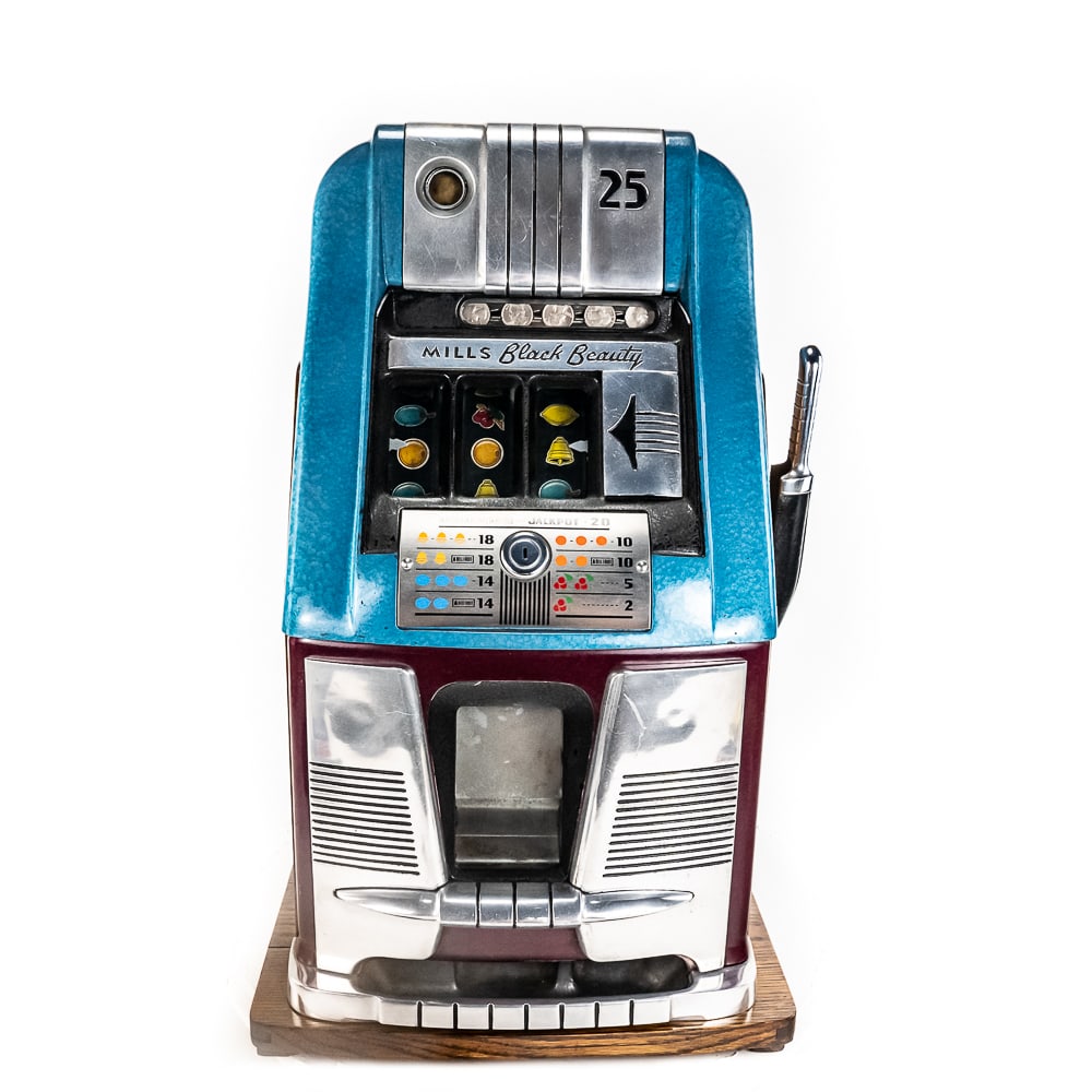 Vintage Mills Black Beauty 25C Slot Machine: Mills "Black Beauty" 25c high top vintage slot machine. Very good overall condition, quarter drops handle pulls reels spin; 27" x 15" x 16" complete with back and keys. Older restoration shows minor c