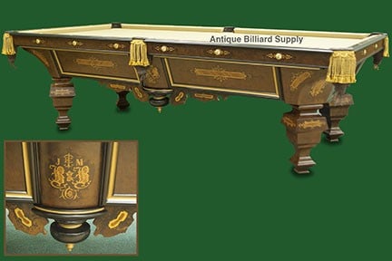 Brunswick Pool Table - French Walnut: NOTE: This pool table is being sold from an off-site location in Rockford, IL. Please call 815.923.7000 to make an appointment for viewing. This ornate Brunswick pool table model was used for champion