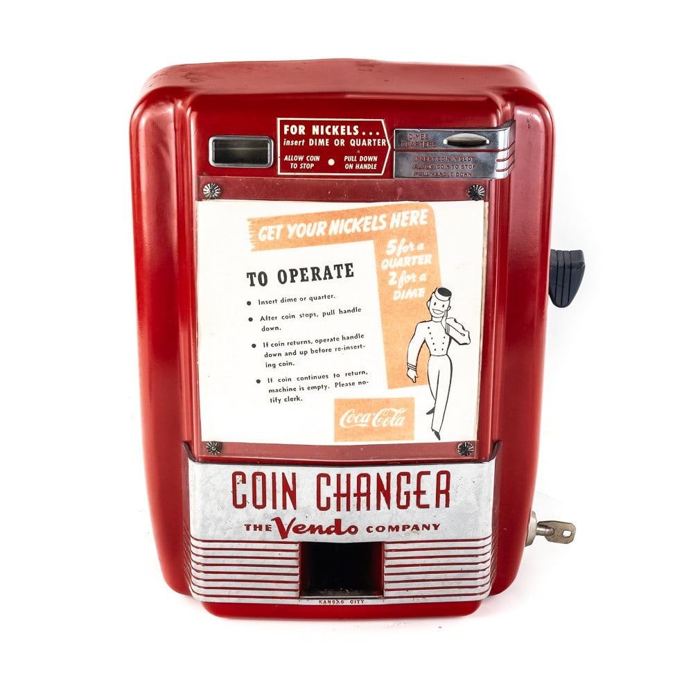 Vendo Coca-Cola Coin Changer w/Key: Vendo Coin Changer Wall Mount Machine. Vendo Company, ca. 1950s. Red-bodied metal machine with chrome parts. Coin slot for dimes or quarters to make change to nickels for Coke machine. . Front marquee