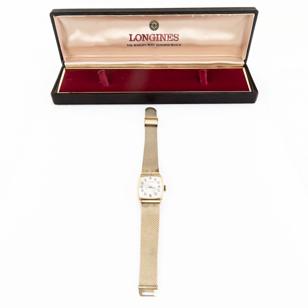 Vintage Longines Diamond 14k Gold Mens Watch: Circa 1975 Longines 14K yellow gold case men's wrist watch featuring a 12 diamond face. Very good overall condition with minimal wear noted indicative of age and light use noted including some light s