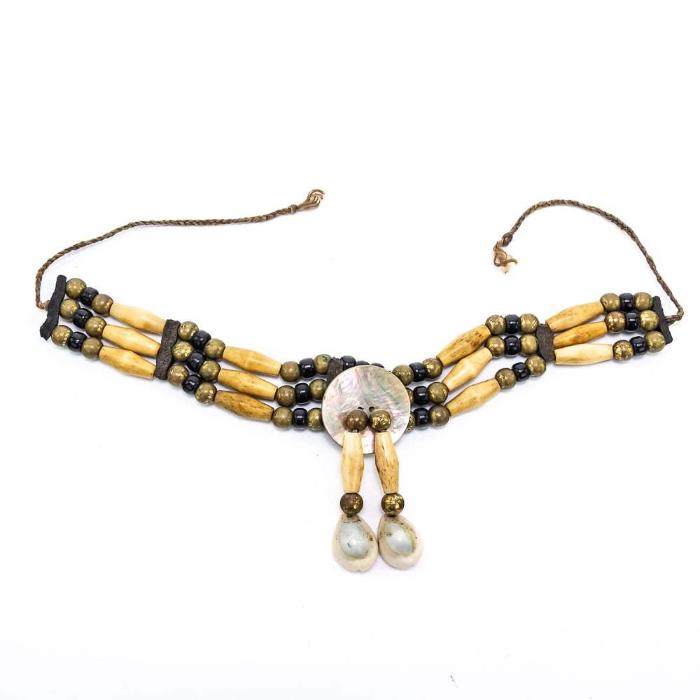 1930s Native American Choker Accessory: Native American choker circa 1930s features a design that incorporates black glass and brass beads, along with cylindrical bone , abalone, leather and seashells, held together with woven twine. In ver