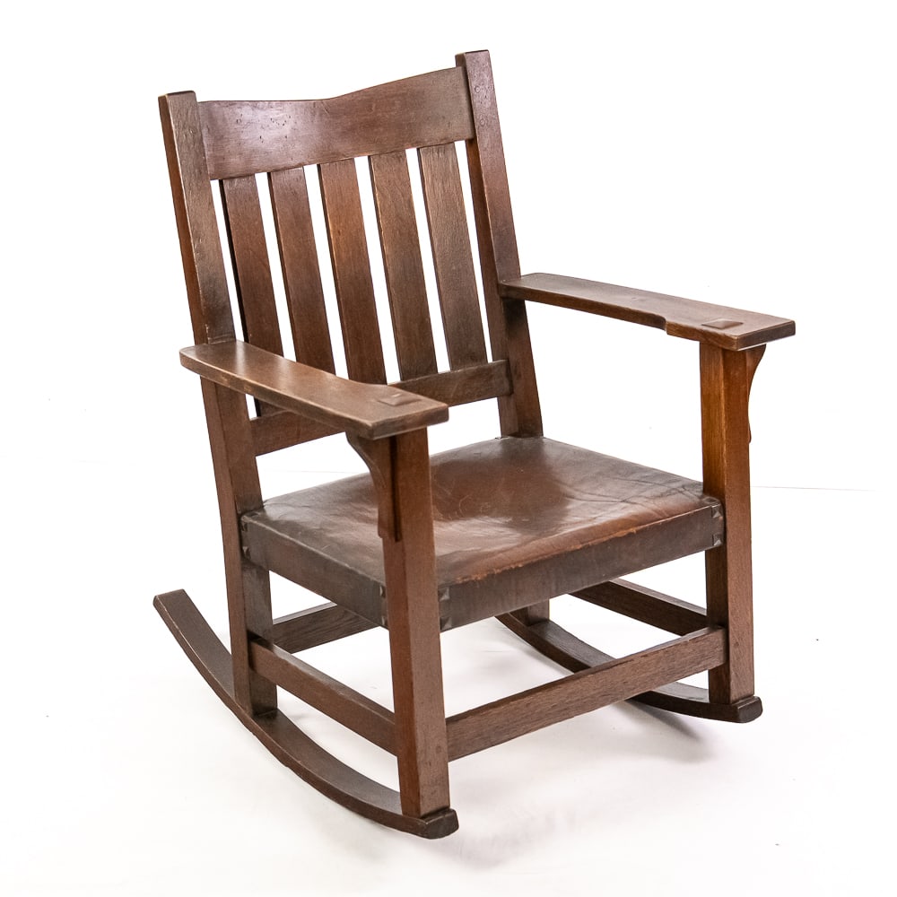 Gustav Stickley Craftsman Workshops Rocker: This is a fantastic example of a Gustav Stickley Craftsman Workshops rocker, likely made of quarter-sawn oak, which embodies the clean lines and functional design of the American Arts and Crafts movem