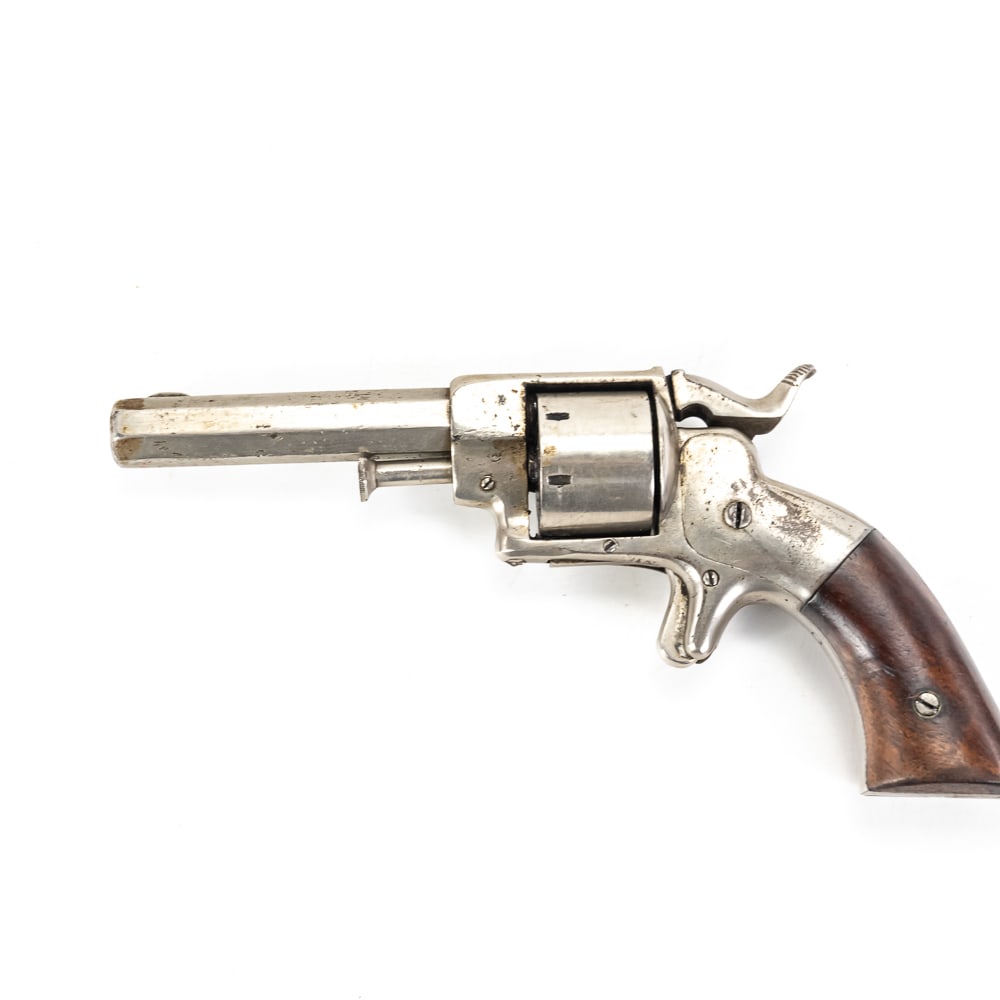 Ethan Allen & Co. Side Hammer Revolver .22 (A): Ethan Allen & Co. Side Hammer Revolver. This .22 caliber, rimfire revolver has a 2 ¾ - inch octagonal barrel with a 7-shot cylinder. It exhibits a nickel finish, that shows oxidation and usage/wear m