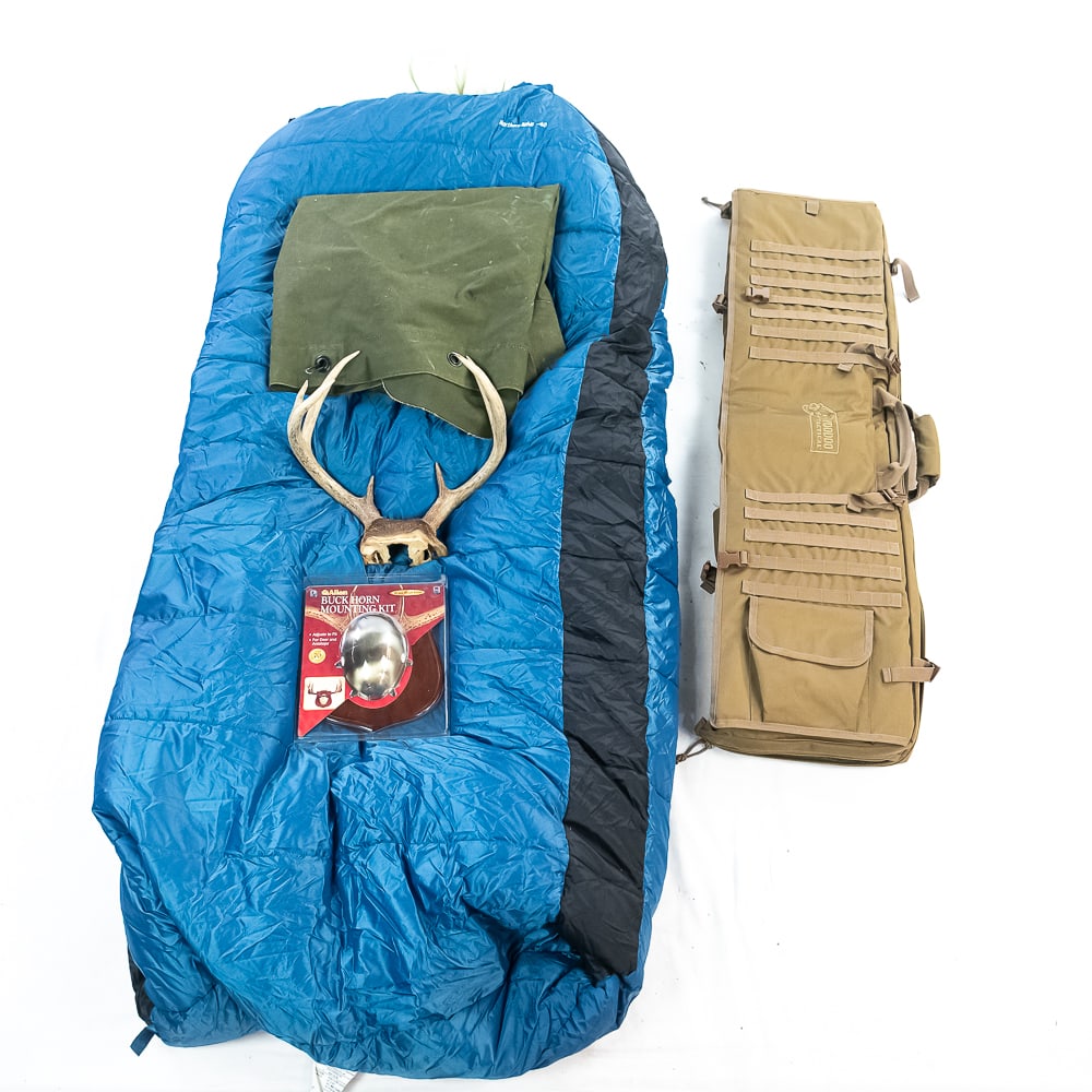 Voodoo Tactical Rifle Bag and More: Voodoo Tactical 48" Deluxe padded rifle case in Coyote color. Excellent like new condition. Lot includes Guide Gear Northern Lights -40 Sleeping bag, GI duffle bag, and deer antlers with mounting kit.