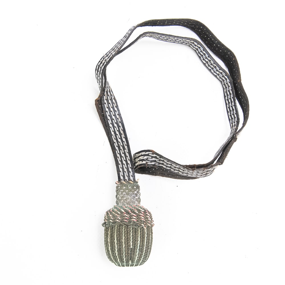 WWII Portepee/Sword Knot: WWII portepee consisting of a stylized acorn with copper bullion and red thread. Copper has oxidized. Suspended from leather strap, stitched with aluminum silver thread. Some fragile points in leather