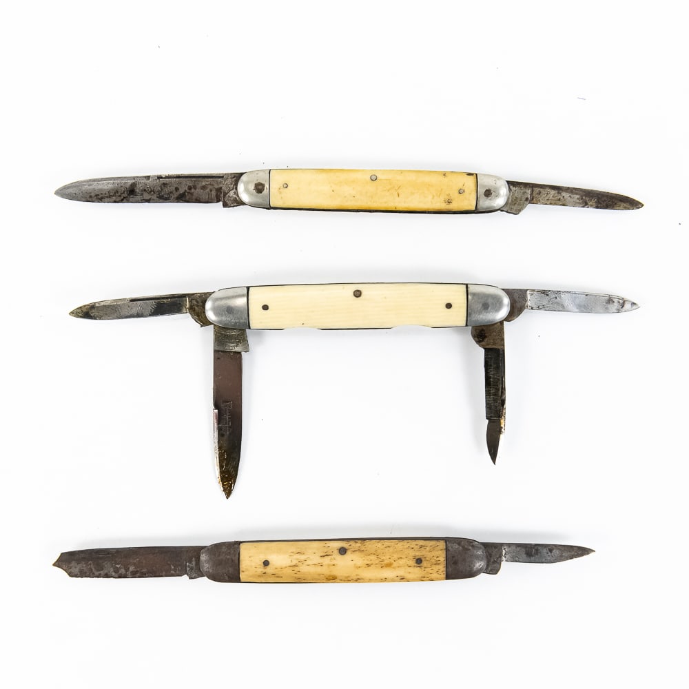 3 Antique Solingen Pocket Knives: 3 Pre-1940s Solingen Germany made pocket knives. All are 2 blade pen knife style with bone or possibly ivory handles. 1 Schmachtenburg Brothers knife is in excellent used condition aside from numbers