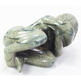 Green Marble Statue Girl Curled Up Rock Formation