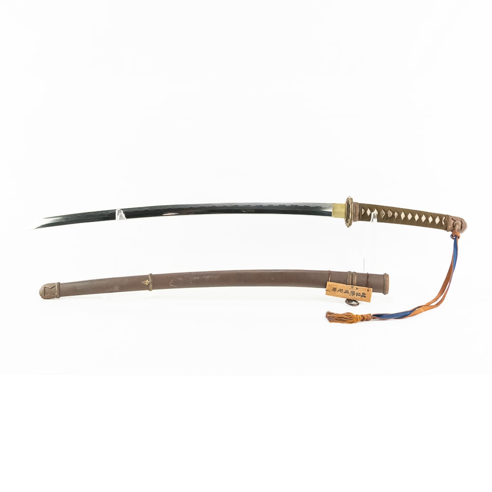 WWII Japanese Army Officer Sword W/Knot: Standard WWII Army Officer Field Sword with a Blue/Brown sword knot-with Surrender Tag! BLADE: Not dated, but circa 1942 with Seki Arsenal Stamp. Signed “Kane Nao” BLADE MARKINGS: Blade in