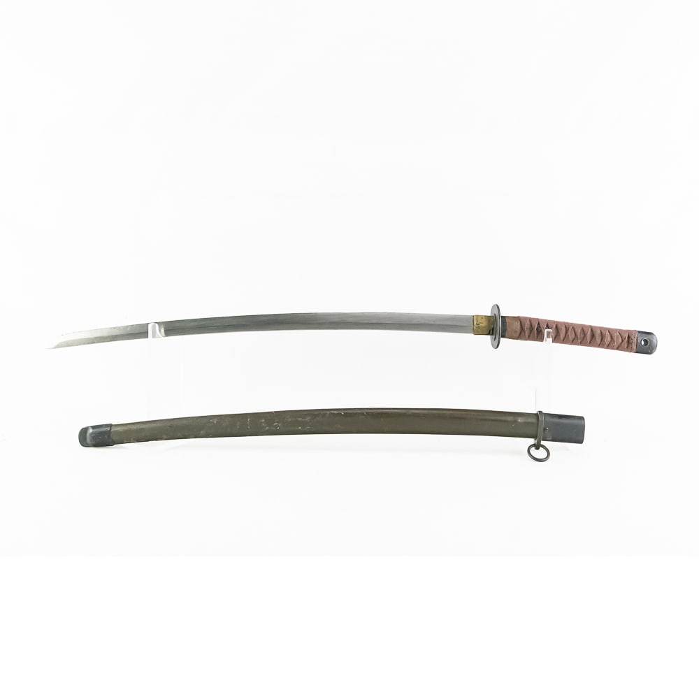 Rare Late War Last Ditch NCO Japanese Sword: Rare Late War Last Ditch NCO Japanese Sword. BLADE: Machine made in very good condition. BLADE MARKINGS: No. HABAKI: Brass. GUARD (Tsuba): Black iron fittings. HANDLE (Tsuka): Wrap in good condition.