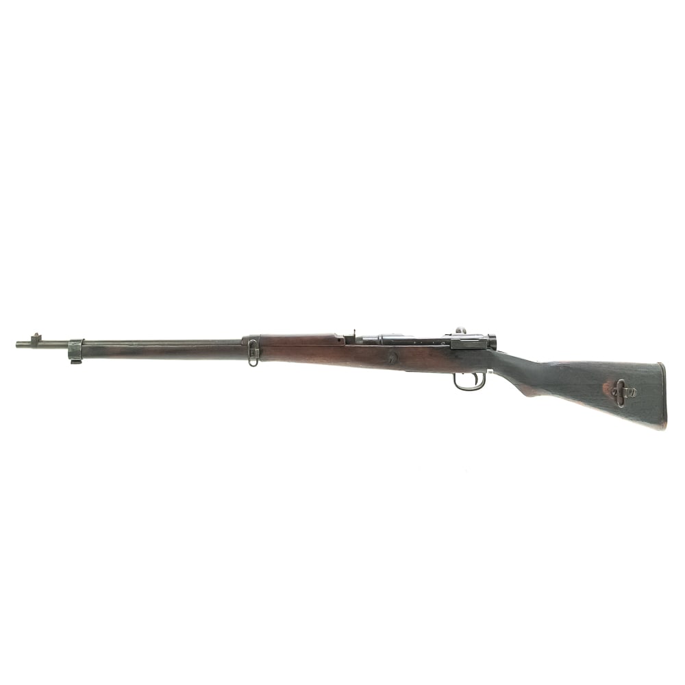 2nd TJK CC Arisaka Type99 7.7 Rifle (C) 3295: 2nd series TJK Concentric Circle Arisaka Type 99 7.7 Rifle. This is a "last ditch"- wood butt plate type rifle with non-matching bolt.. The stock is seriously burnt. The non burnt wood is consistent