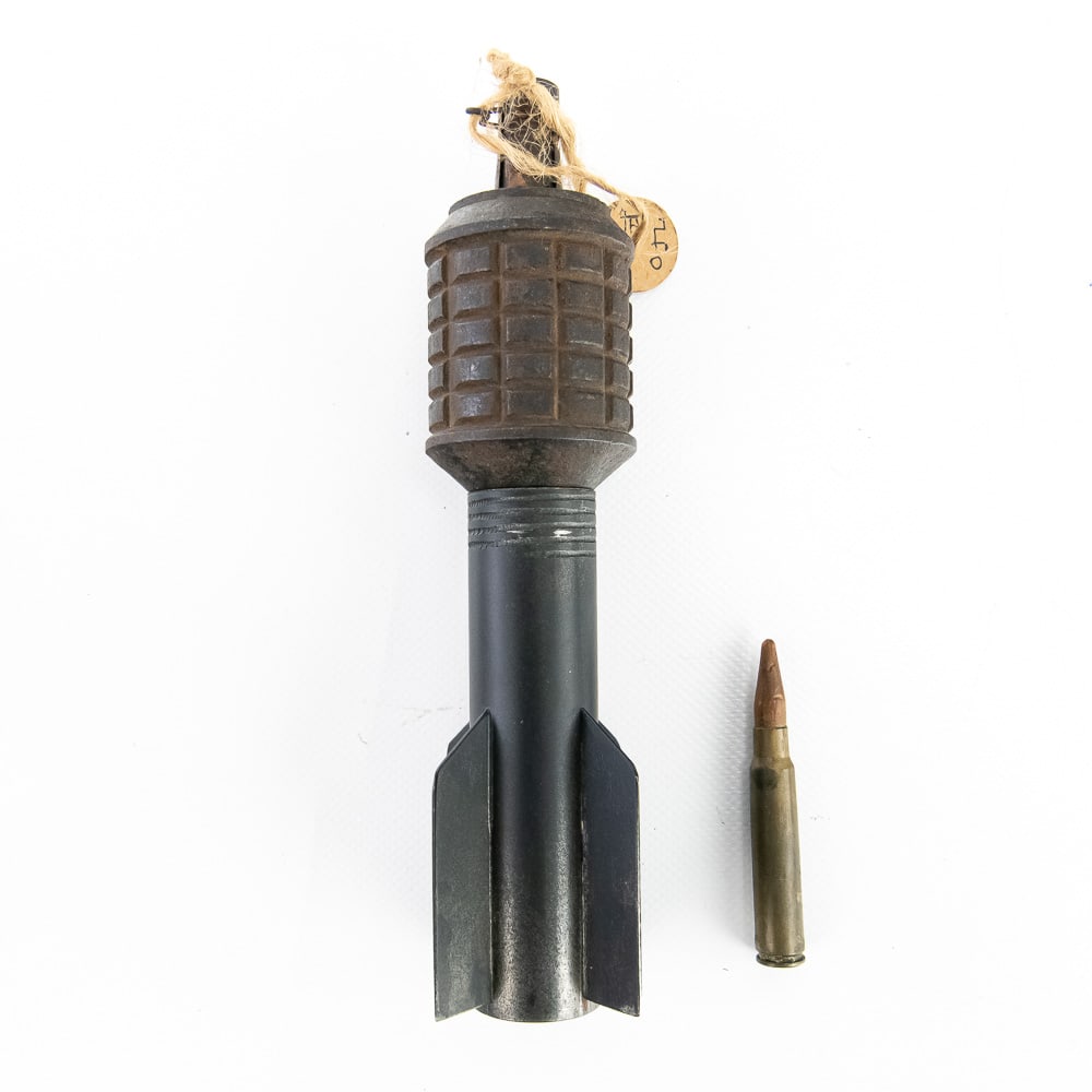Japanese Type 91 Rifle Grenade & Wooden Cartridge: A RARE World War II Japanese Type 91 Rifle Grenade (INERT) with reproduction finned, tail assembly and an original INERT 7.7x58 wooden bullet cartridge. The Japanese Type 91 rifle grenade, produced fr