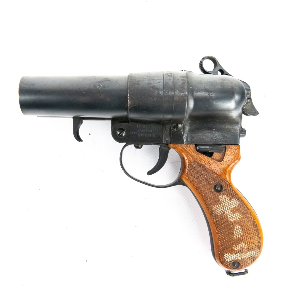 Imperial Japanese Navy Type 90 Flare Pistol: Imperial Japanese Navy Type 90 Double-Barrel Flare Pistol manufactured by Kayaba Kogyo Mfg. Co. The construction is robust, featuring a blackened, blued steel body and barrels with smooth, varnished