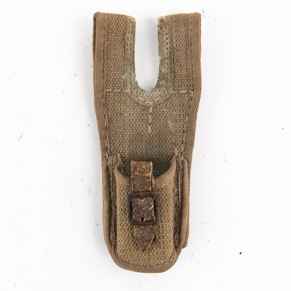 Rare Japanese Canvas Frog: Outstanding example of a canvas frog with unusual reinforced edges around the perimeters. Loose weave construction with double loops, iron buckle with intact leather strap. 6 1/2"L