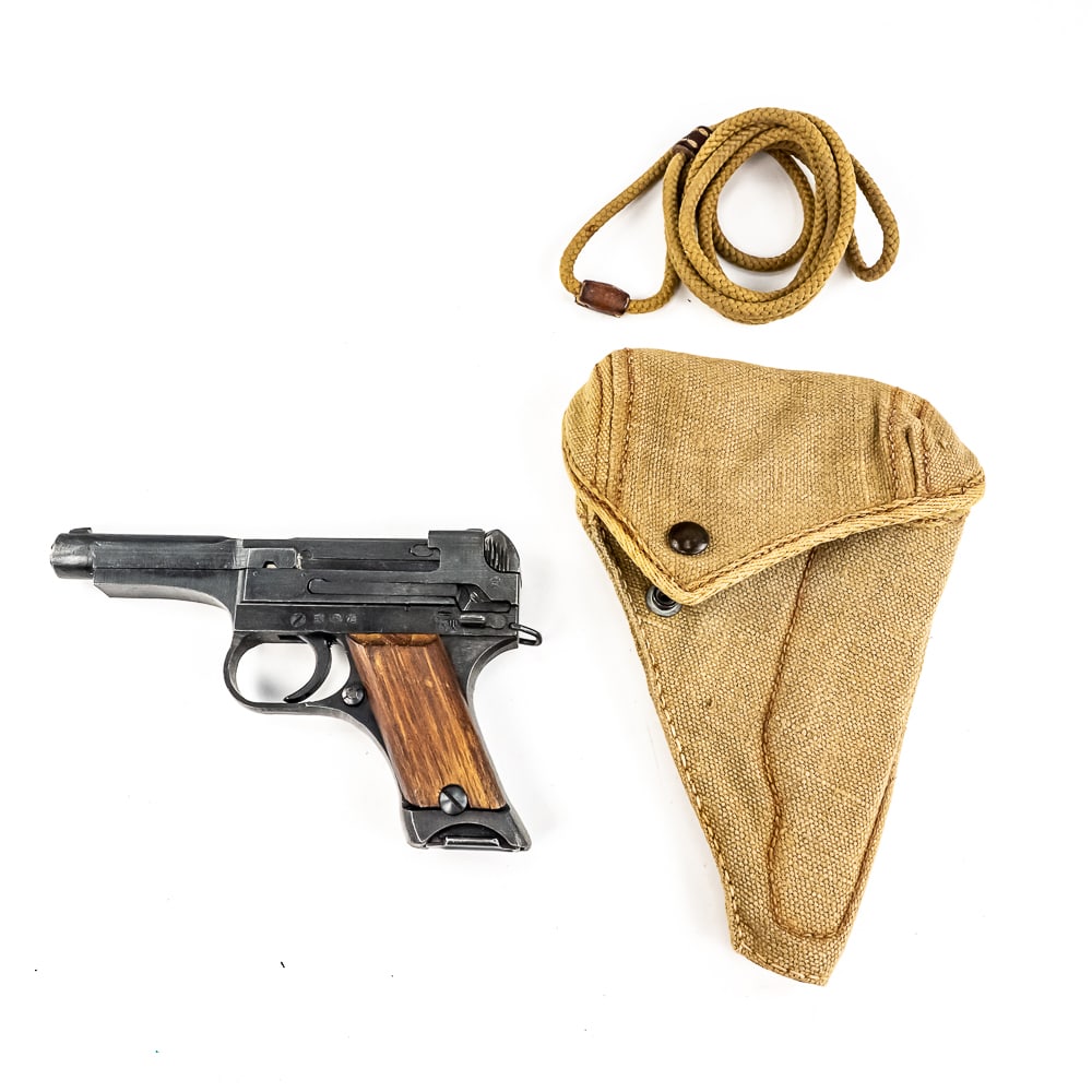 Japanese Type 94 8mm Nambu Pistol (c) 59313: WW2 Japanese Type 94 pistol made by Nagoya in August of 1944. Very nice gun with one matched mag with canvas holster. Condition is 99% and is near factory mint. Appears unfired. Perfect wood grips and