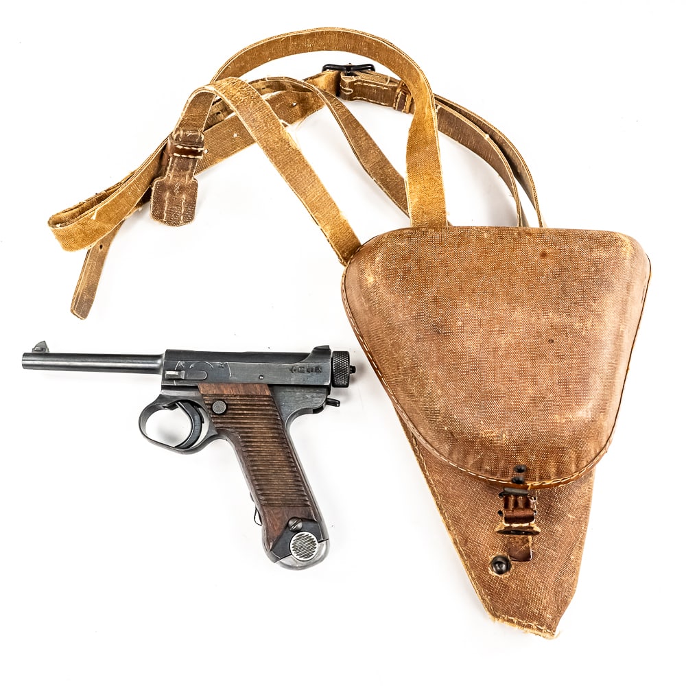 Japanese Type 14 (32489): World War II Japanese Type 14 pistol made by Nagoya in April of 1944. Very nice gun with two matching mags and holster with cleaning tool and spare firing pin. Condition is 98% and is near factory min