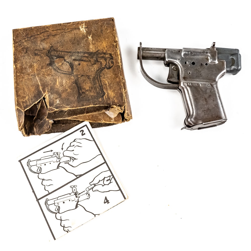 RARE WWII Liberator Pistol w/Original Box (C): A remarkable piece of World War II weapons history, a FP-45 Liberator pistol. This single-shot .45 ACP pistol was designed by George Hyde and manufactured by General Motor’s Guide Lamp Division