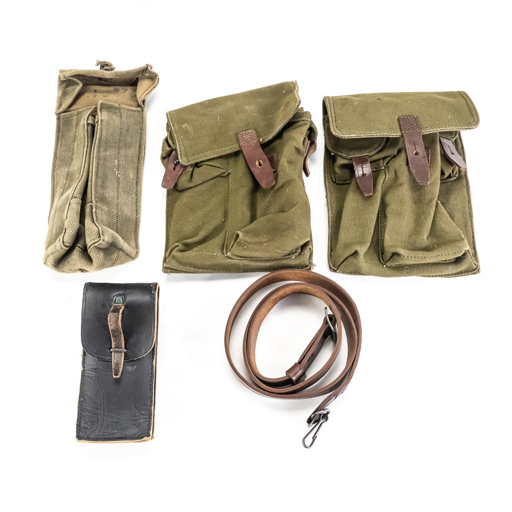 Cold War Military Gear Lot: Mixed lot of Cold War era military gear. Lot includes 2 Russian military AK 3-mag pouches, 1 Romanian leather AK sling, Leather SKS pouch with 10 empty stripper clips, and 1 British/Israeli P37 pouch.