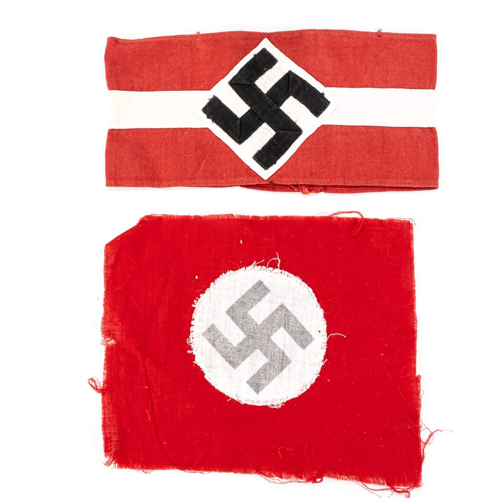 WWII German HJ Armband and Flag Piece: This lot features a multi-piece construction Hitler Youth (HJ) style armband and a separate red cotton flag fragment featuring a printed swastika on a white roundel. The armband exhibits the