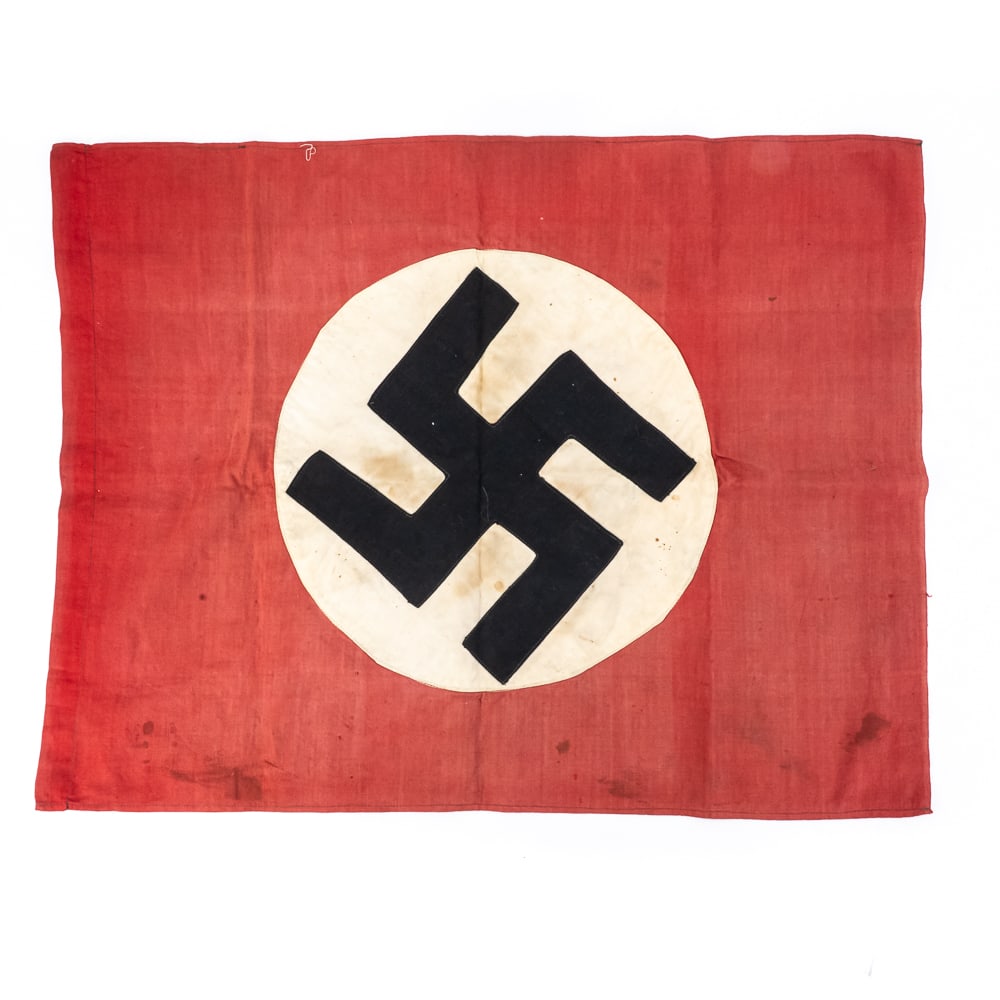 WWII German NSDAP Banner: This WWII-era German NSDAP swastika banner is a double-sided relic constructed from red cotton fabric with a multi-piece construction. The central white rondel and black swastika are separately