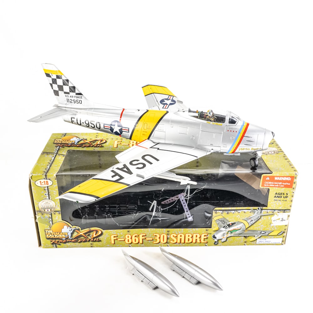Ultimate Soldier 1/18 Scale F-86f-30 Sabre W/Box: Ultimate Soldier 1/18 scale F-86F-30 Sabre. Assembled and complete with additional pieces in original box. Airplane is marked for “Pilot Col Mitchell” below the canopy and