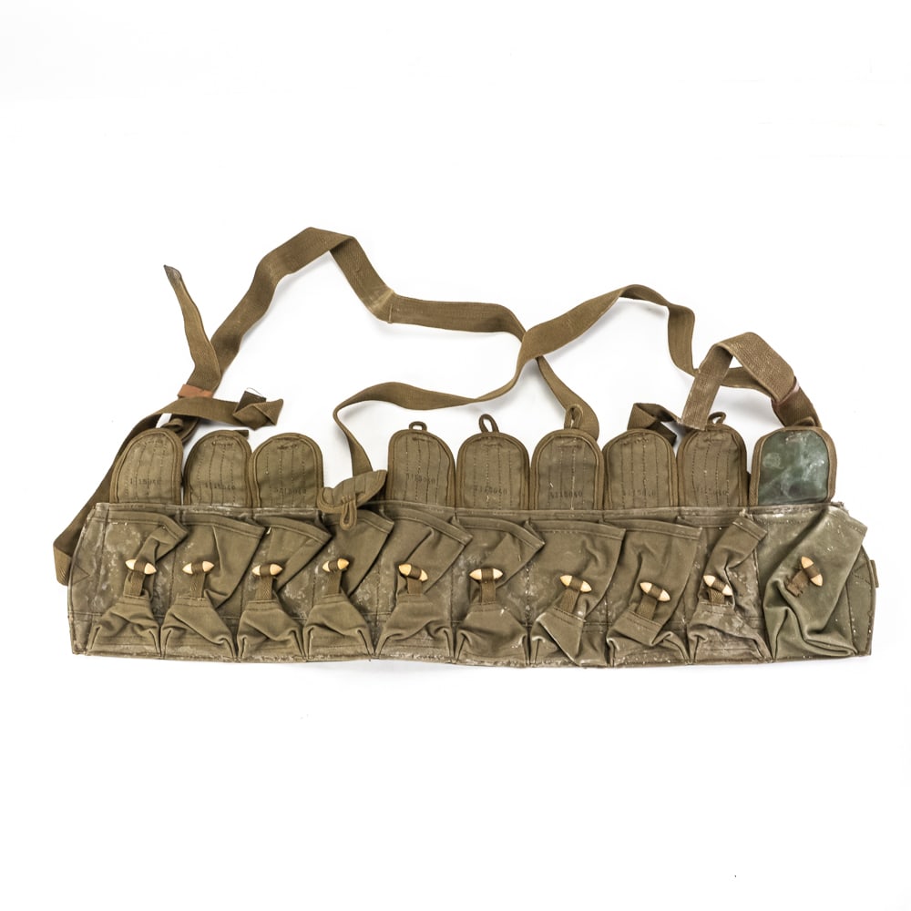 Vietnam War, Chinese Type 56 SKS Chest Rig: This original Vietnam War, Chinese Type 56 chest rig is a classic piece of Cold War military surplus. This ten-pocket rig is designed to hold 10-round stripper clips for the 7.62x39mm SKS rifle.