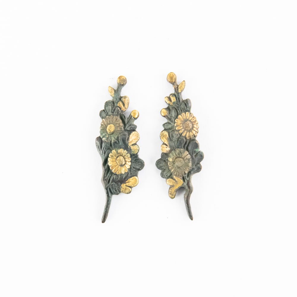 Pair of Antique Japanese Chrysanthemum Menuki: A striking pair of Japanese Menuki, or handle ornaments, from a Samurai sword (Katana or Wakizashi). The design features the chrysanthemum (Kiku), a powerful symbol in Japan representing longevity,