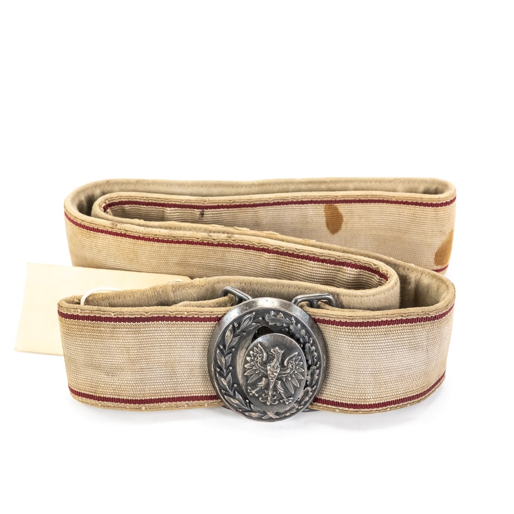 Post-War Polish Army Dress Belt W/Buckle: A Polish People's Army (LWP) dress belt, likely dating from the Post-War period. The belt features a woven fabric strap, approximately 1.75" wide, in a light, possibly off-white or tan color,