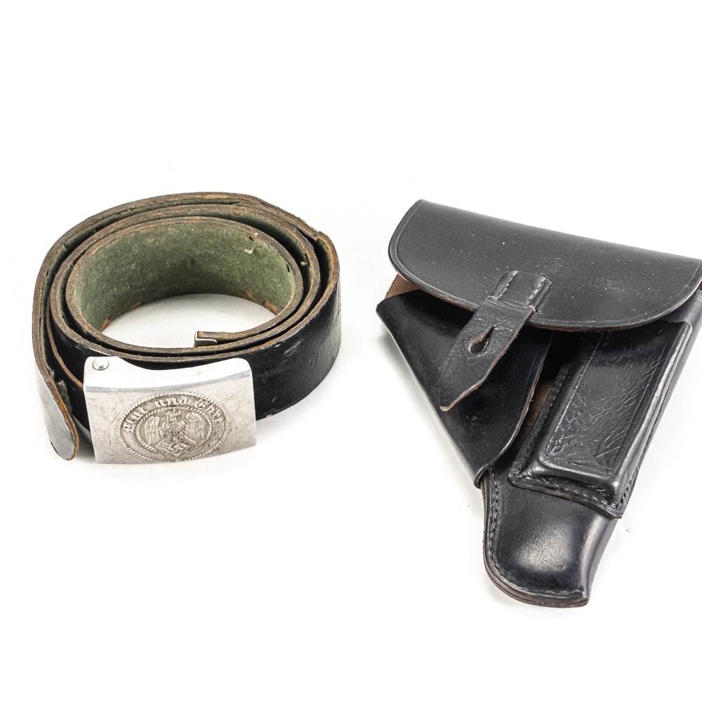 WWII German HJ Belt & Buckle and HSc Holster: This grouping features a WWII-era German Hitler Youth (HJ) aluminum belt buckle accompanied by its original leather belt and a black leather pistol holster. The buckle displays the eagle and swastika