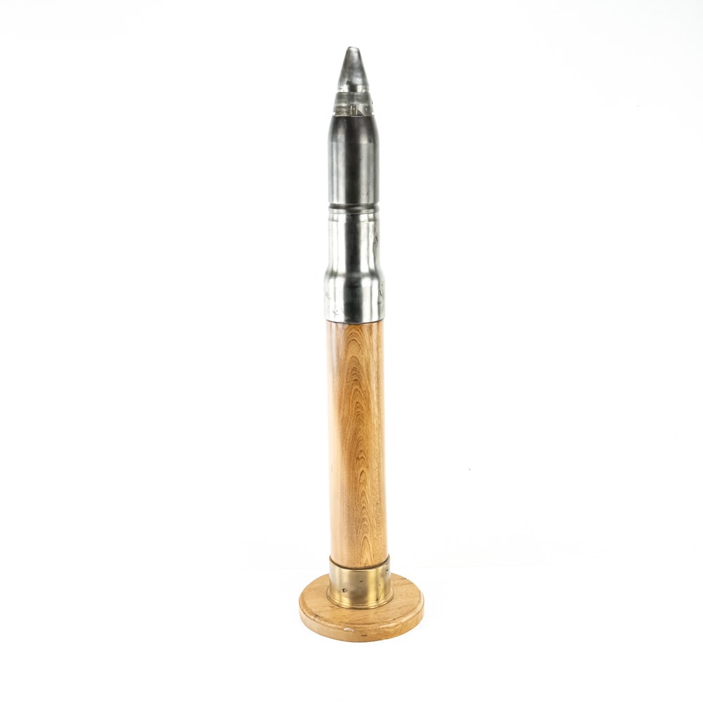Wooden US Navy 3"/50 Drill Round: WW2 Era US Navy drill Round. Used for practicing loading and unloading 3''/50 Deck gun. This shell is constructed of wood for main body but metal base and front section to reduce use of metal, but