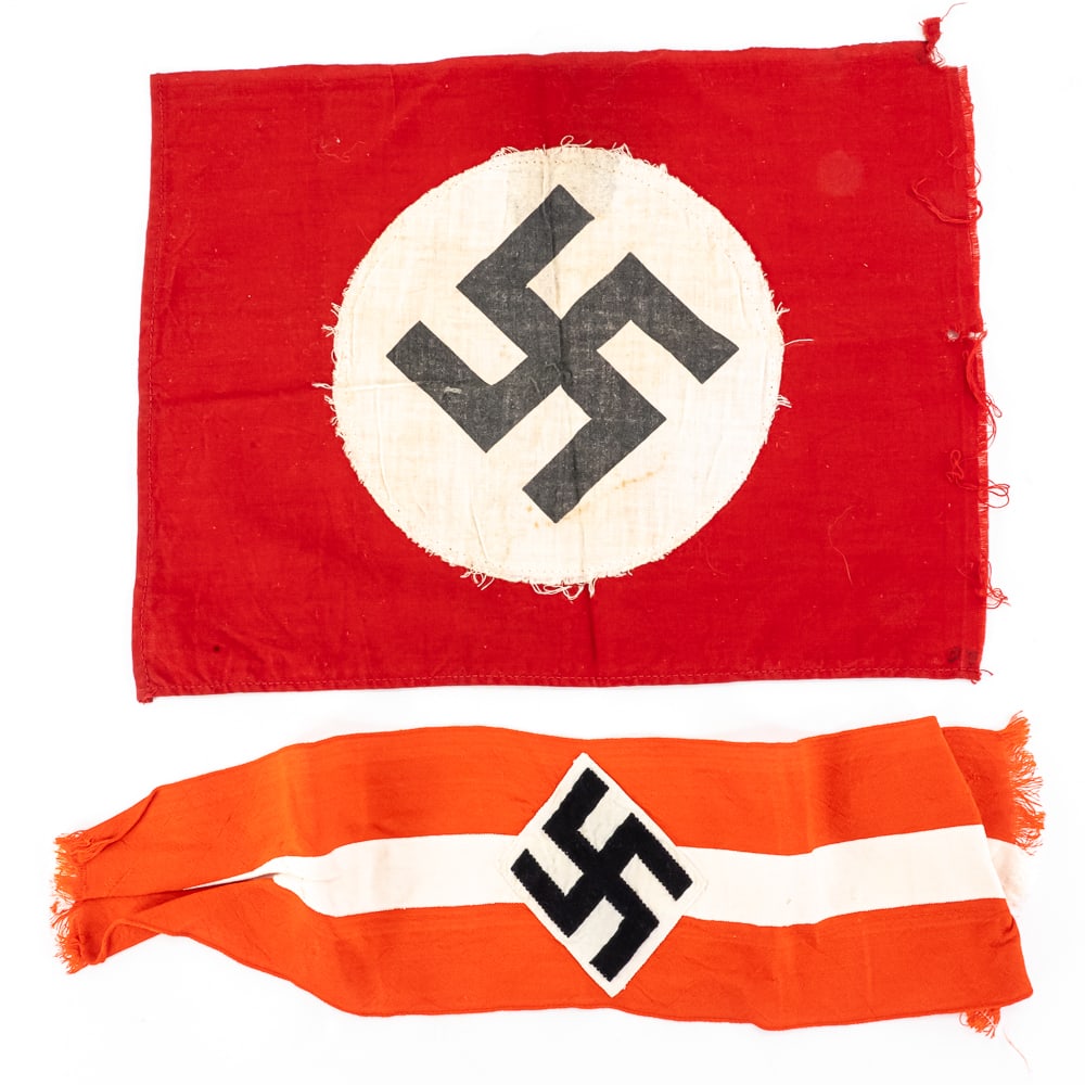 WWII German Flag & Hitler Youth Armband: WWII German Flag & Hitler Youth ArmbandThis lot features two WWII-era German textile relics consisting of a small printed cotton flag and a multi-piece construction Hitler Youth (HJ) style armband.