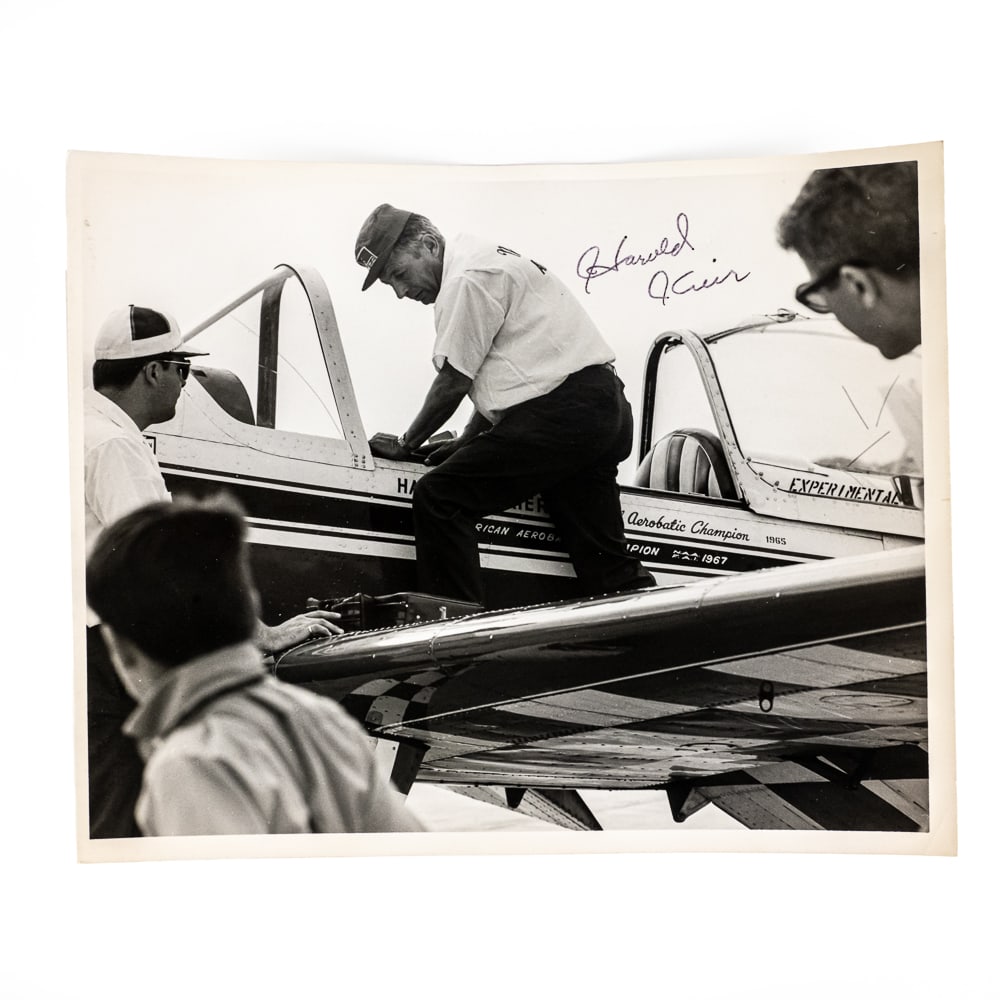 Autographed Photo Aerobatic Champion Harold Krier: 8x10 B&W photograph taken in 1967 at DuPage County Air Show. Harold Krier joined the Army Air Corps where he served as a Flight Engineer during World War II. After the war, he got his pilots