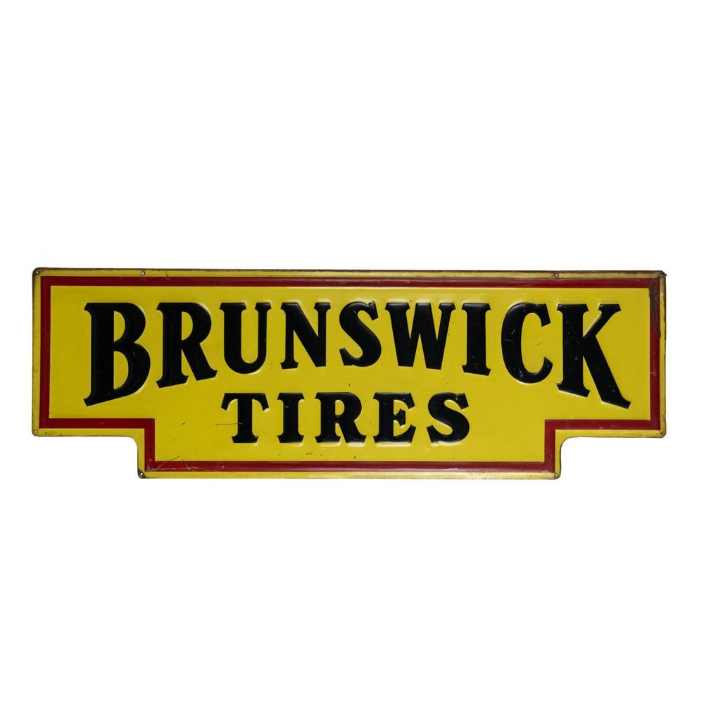 60" Brunswick Tires SST Embossed Advertising Sign: Large and in charge "Brunswick Tires" single sided, embossed metal advertising sign. Good overall condition with some discoloration, scratches, chipped paint / loss and oxidation. Approximately 20"t x