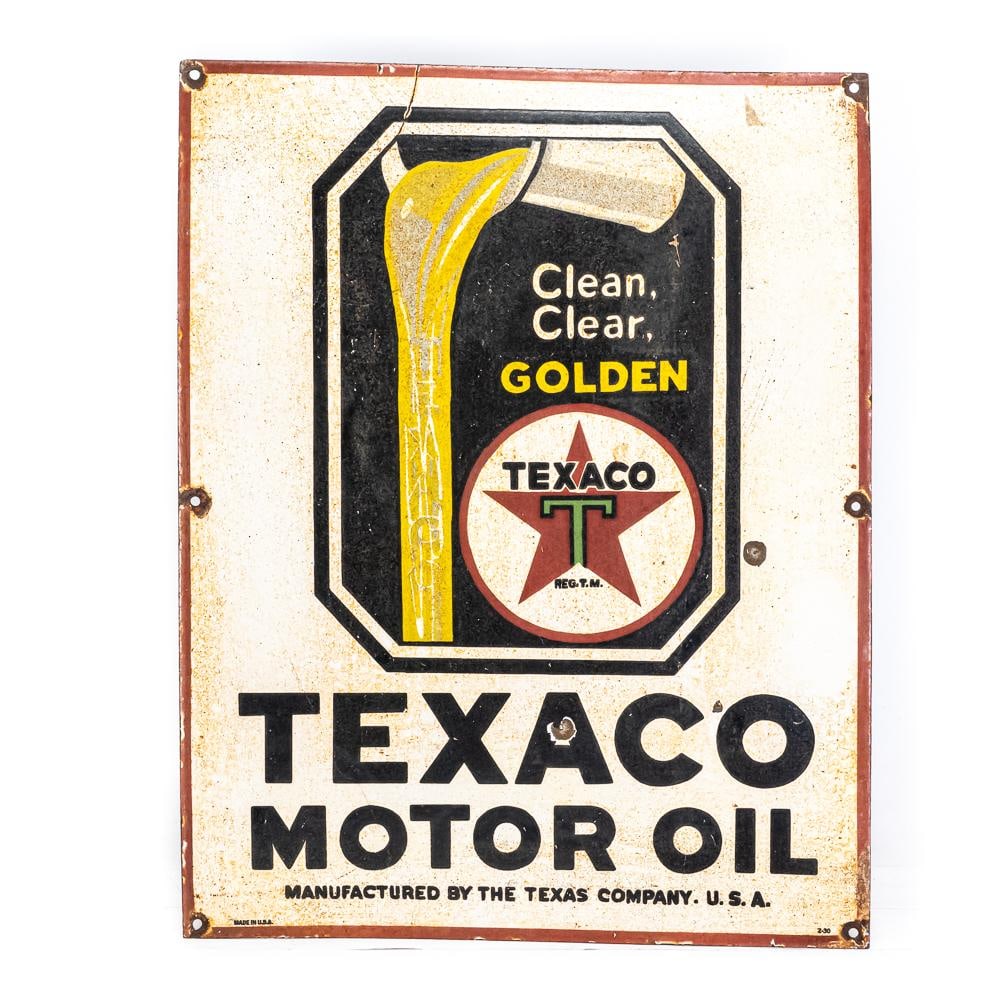 Texaco Clean Clear Golden SSP Advertising Sign: TAXACO Motor Oil single sided porcelain (flange edge missing) advertising sign. "Made in the USA & 2-30" stamped near bottom edge. Good overall condition with age and wear related cosmetic imperfectio