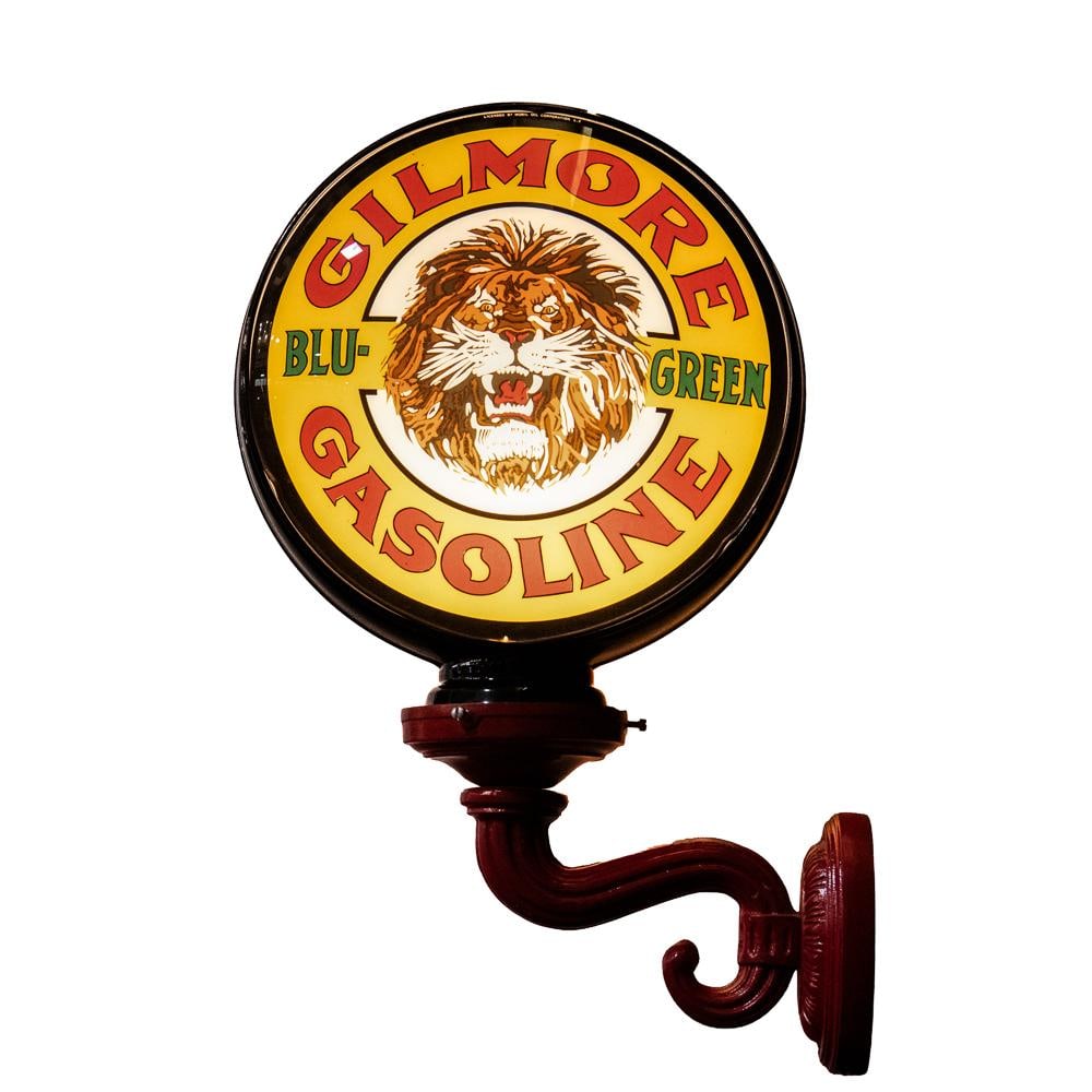 Gilmore Advertising Gas Globe on Red Bracket: Gilmore Gasoline Lighted Wall Sconce Contemporary wall-mounted light fixture featuring dual 14" "Gilmore Blu-Green Gasoline" glass lenses housed in a high-profile black glass body. The lenses bear