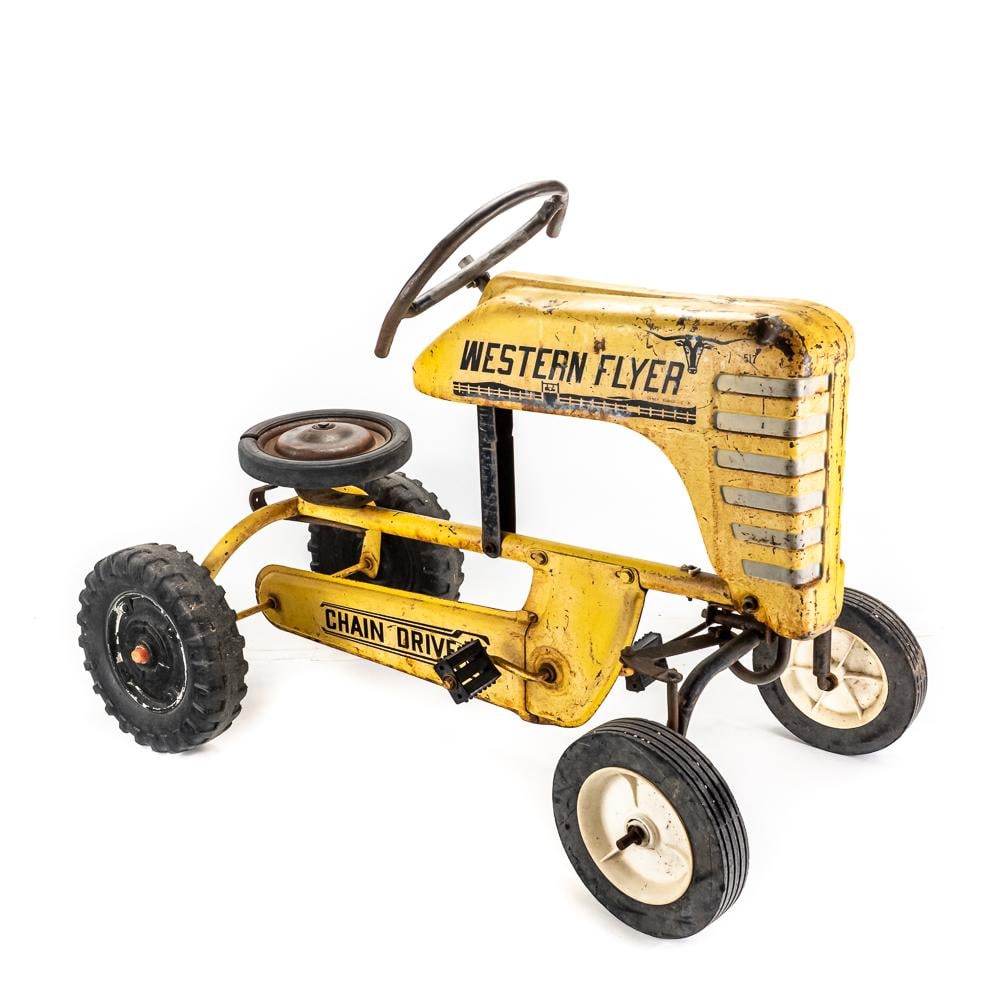 Vintage Western Flyer Yellow Pedal Tractor: Vintage Western Flyer yellow pedal tractor, in good overall condition with moderate age and wear including moderate oxidation and discoloration with non original parts replacements (missing seat). 26"