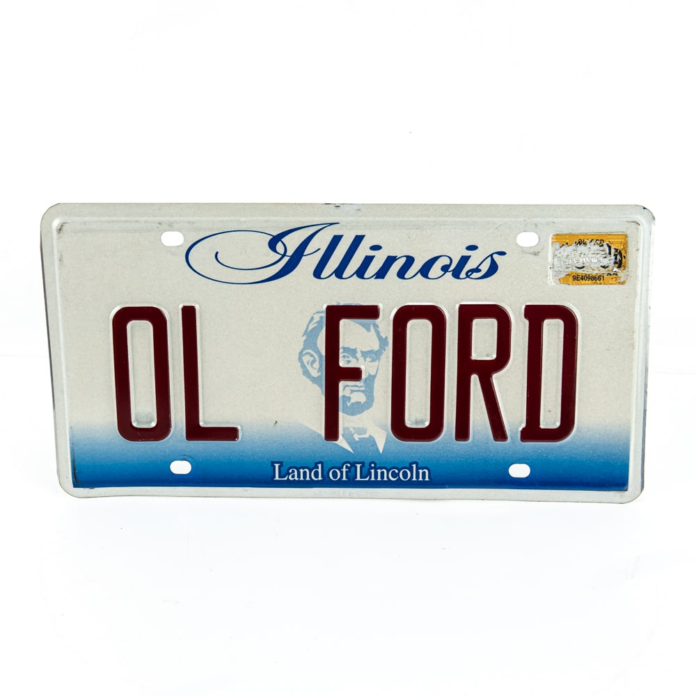 Illinois OL FORD Vanity License Plate: OL FORD vanity plate from the early 2000's in VG original condition. The sticker in the upper right corner has been defaced. See pics. From the Jim Dvorak collection.