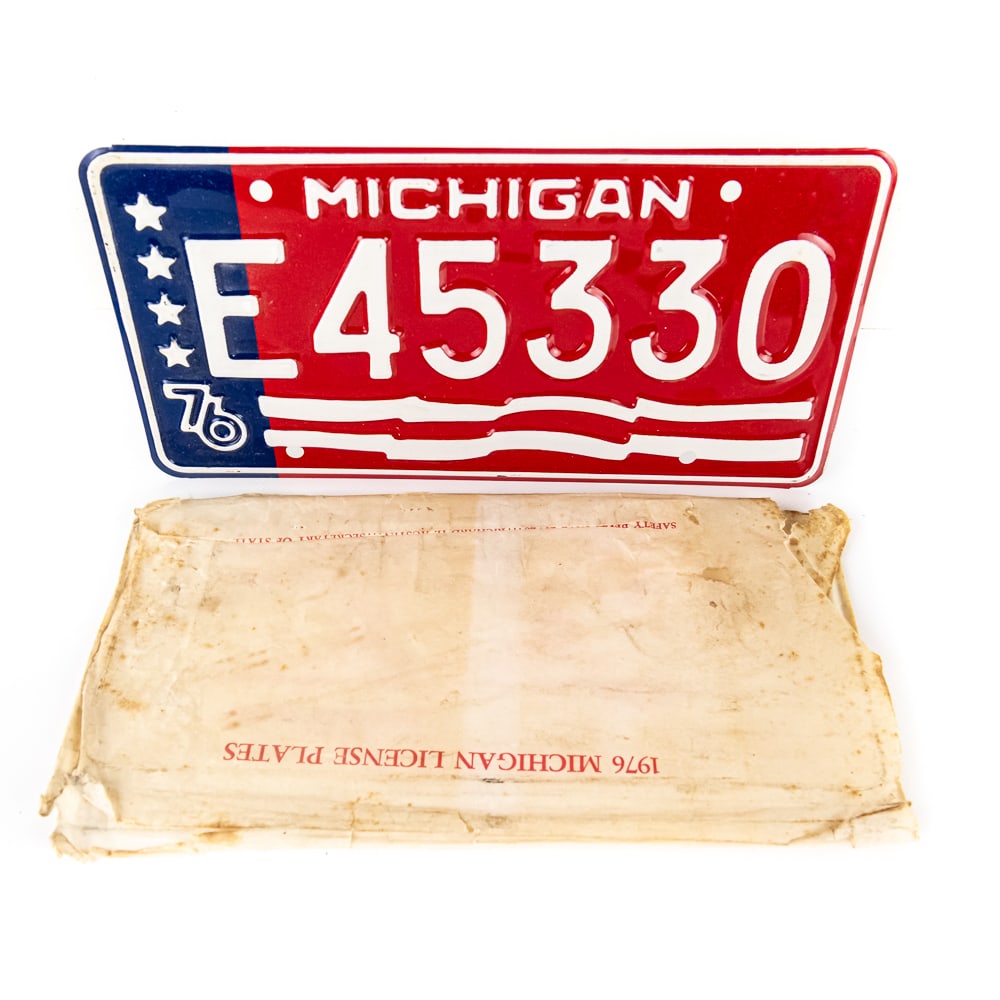 Michigan 1976 License Plate: # E45330 bicentennial plate in VG original condition with original sleeve. See pics. From the Jim Dvorak collection.