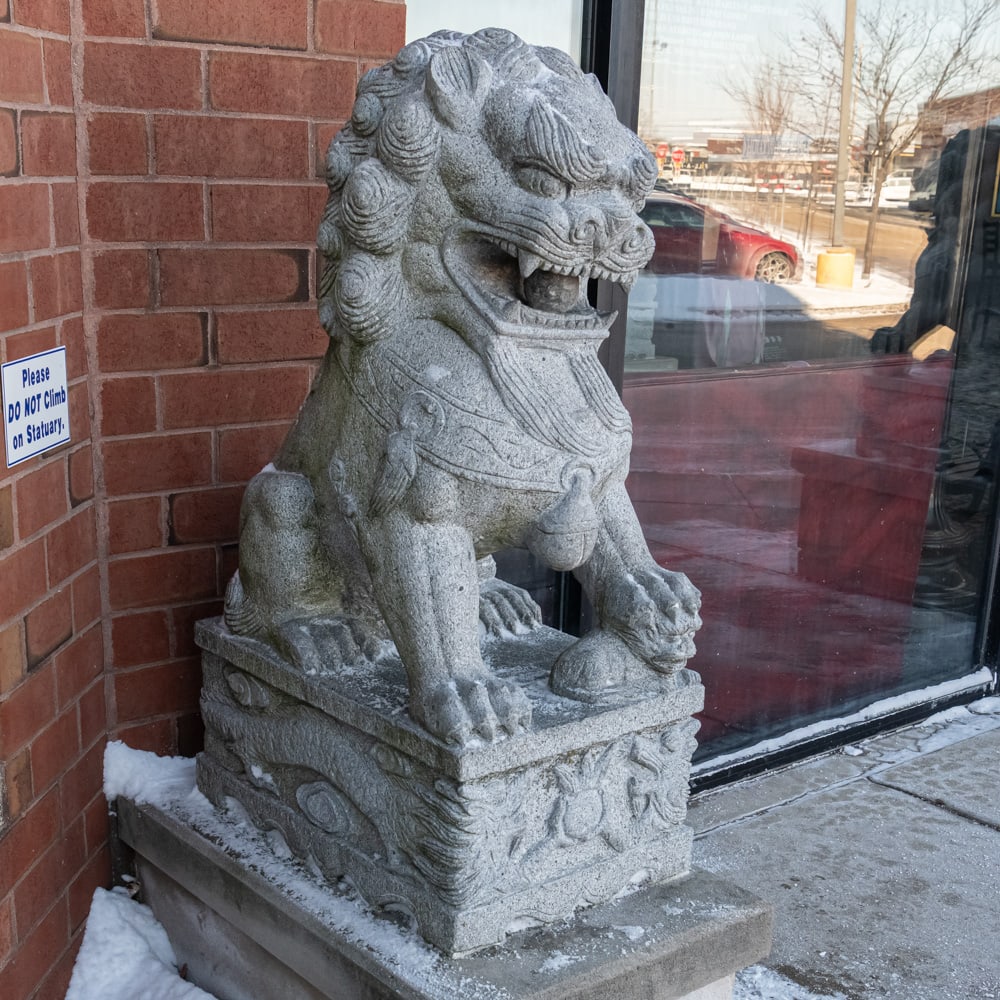 Large Stone Exterior Foo Dog: Large Chinese Foo Dog carved from stone located outside the theater main entrance. In overall good condition. Measures 48" tall, 20" wide, 28" deep. VERY HEAVY Please use photos to judge condition