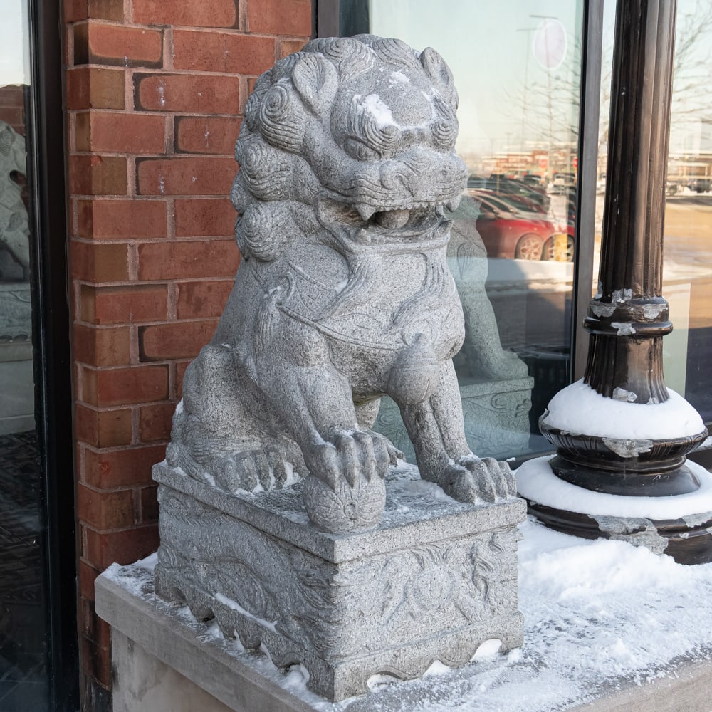 Large Stone Exterior Foo Dog: Large Chinese Foo Dog carved from stone located outside the theater main entrance. In overall good condition. Measures 48" tall, 20" wide, 28" deep. VERY HEAVY Please use photos to judge condition