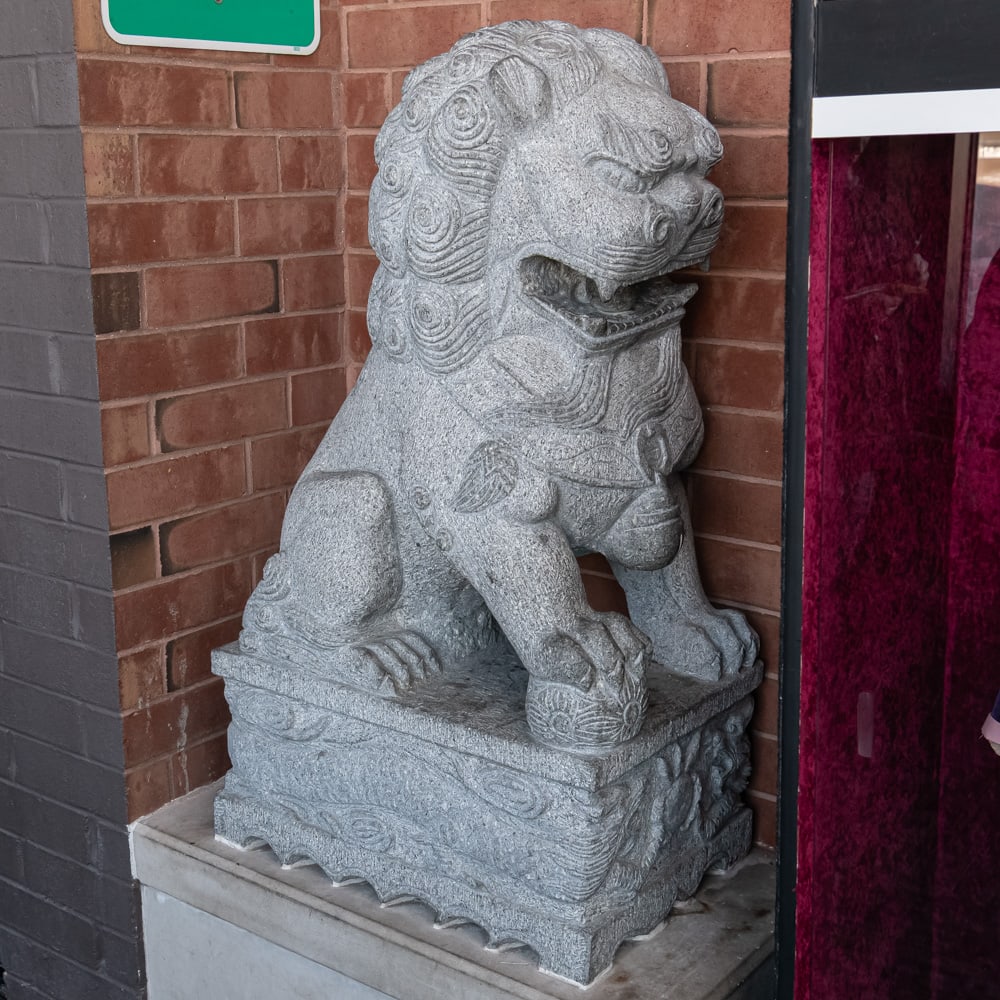 Large Foo Dog: Large Chinese Foo Dog carved from stone located in theater lobby. In overall good condition. Measures 48" tall, 20" wide, 28" deep. VERY HEAVY Please use photos to judge condition and bid accordingly.