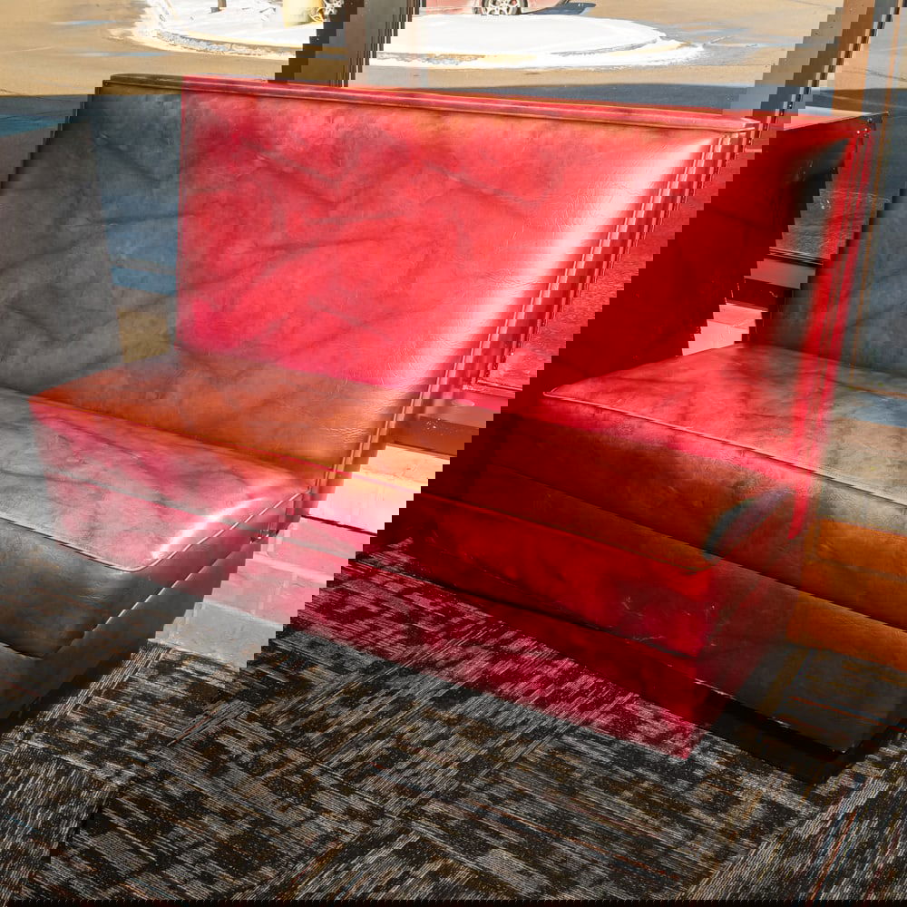Vintage Restaurant Booth Bench: Classic mid-century style commercial restaurant booth, featuring a robust high-back design upholstered in a marbled or "cracked ice" patterned burgundy leatherette. This style was a staple of