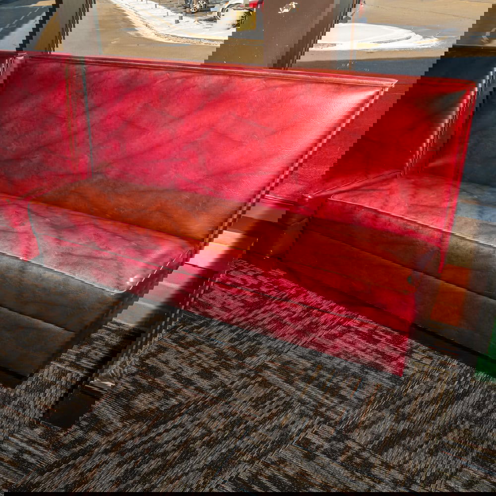 Vintage Restaurant Booth Bench: Classic mid-century style commercial restaurant booth, featuring a robust high-back design upholstered in a marbled or "cracked ice" patterned burgundy leatherette. This style was a staple of