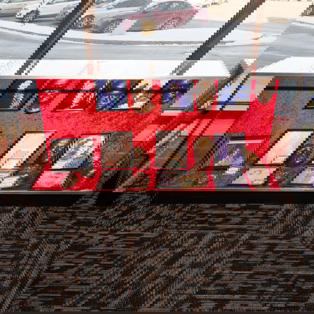 Glass Showcase: Glass showcase with sliding doors on the back in good condition. Measures 70" wide x 20" deep x 38" tall.Please use photos to judge condition and bid accordingly. Please note: Buyer is responsible