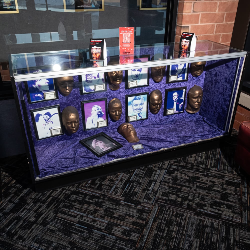 Glass Showcase: Glass showcase with sliding doors on the back in good condition. Measures 6' wide x22" deep x 38" tall. Please use photos to judge condition and bid accordingly. Please note: Buyer is responsible