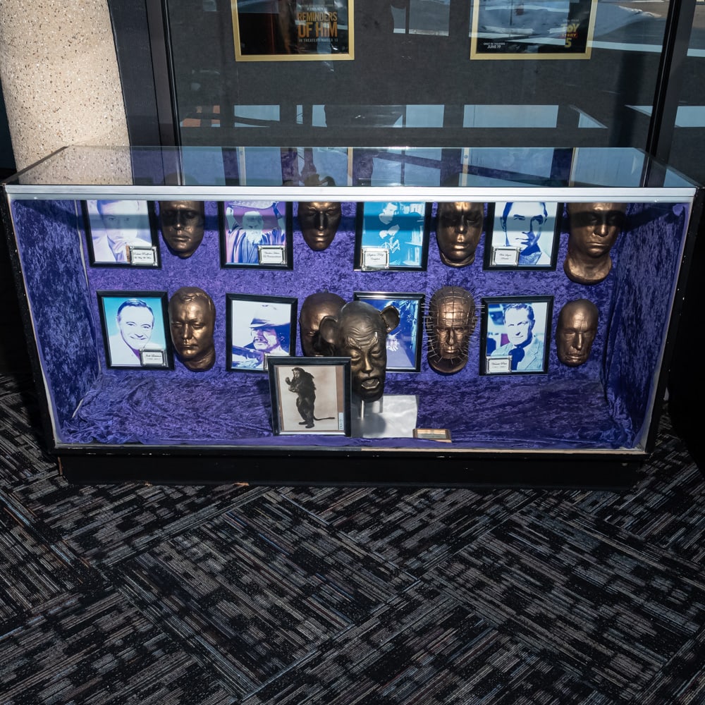 Glass Showcase: Glass showcase with sliding doors on the back in good condition. Measures 6' wide x22" deep x 38" tall. Please use photos to judge condition and bid accordingly. Please note: Buyer is responsible