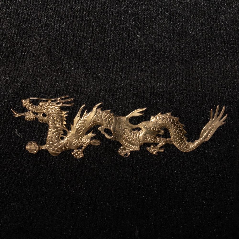Left Facing Golden Dragon: This striking piece is a classic example of Mid-Century Orientalist decor, likely of Chinese or Hong Kong origin from the mid-20th century. Crafted from heavy-gauge pierced brass, the dragon is depict